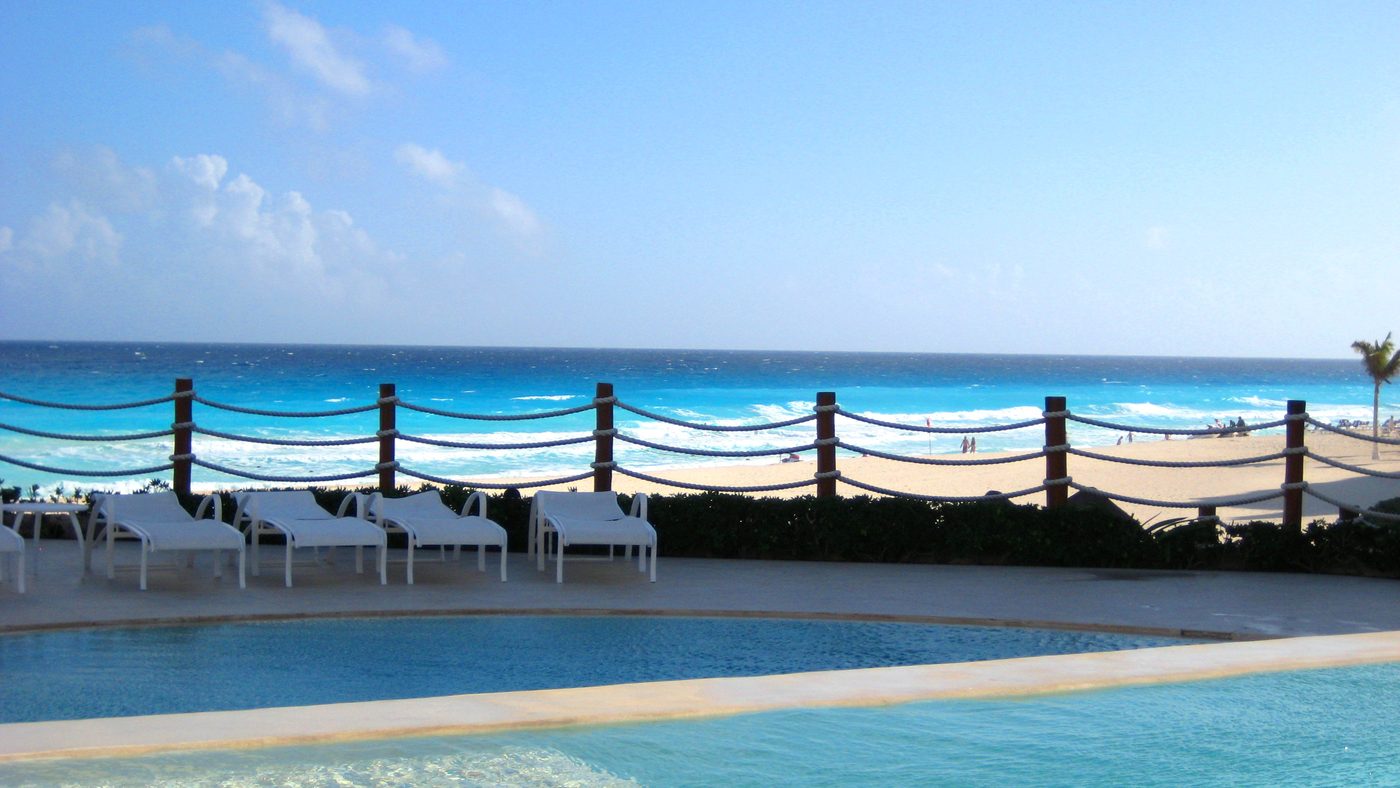 Friends enjoying a resort pool day in Cancun