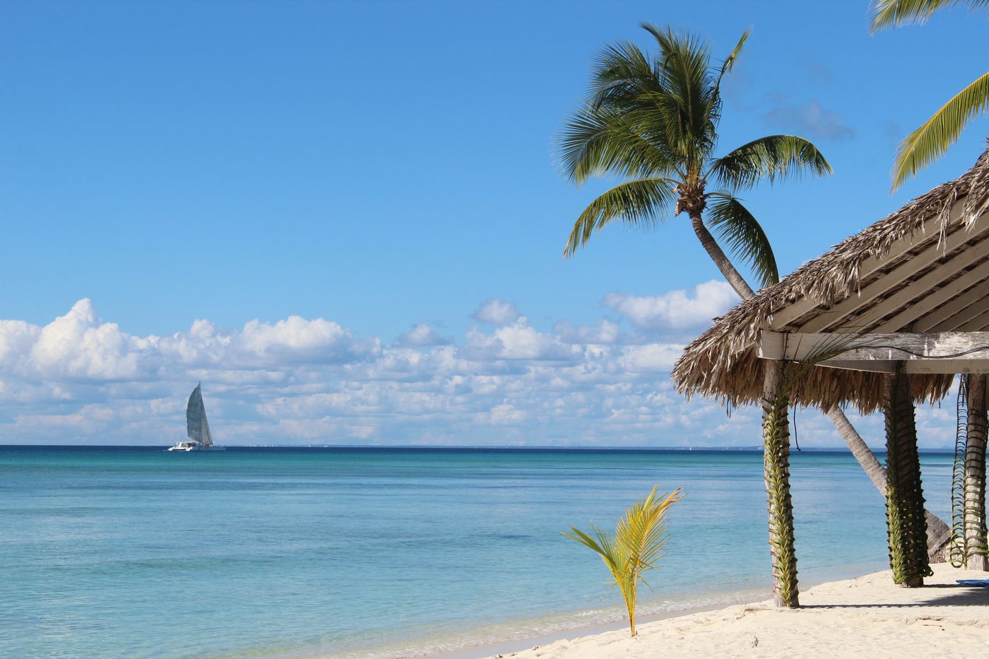 Catamaran anchored near a shallow sandbar in the Caribbean Sea