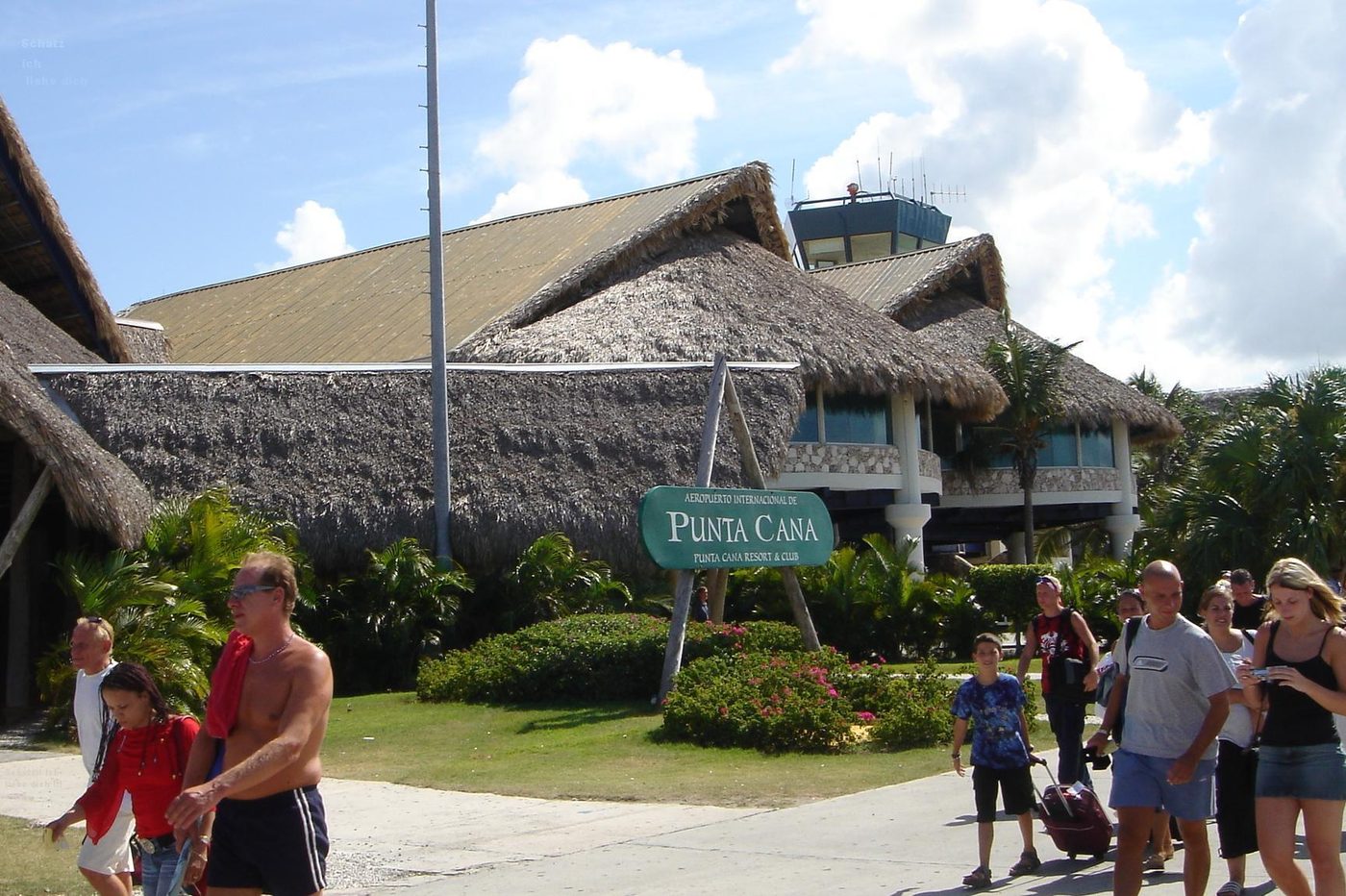 Shuttle van being loaded with luggage for a group resort transfer