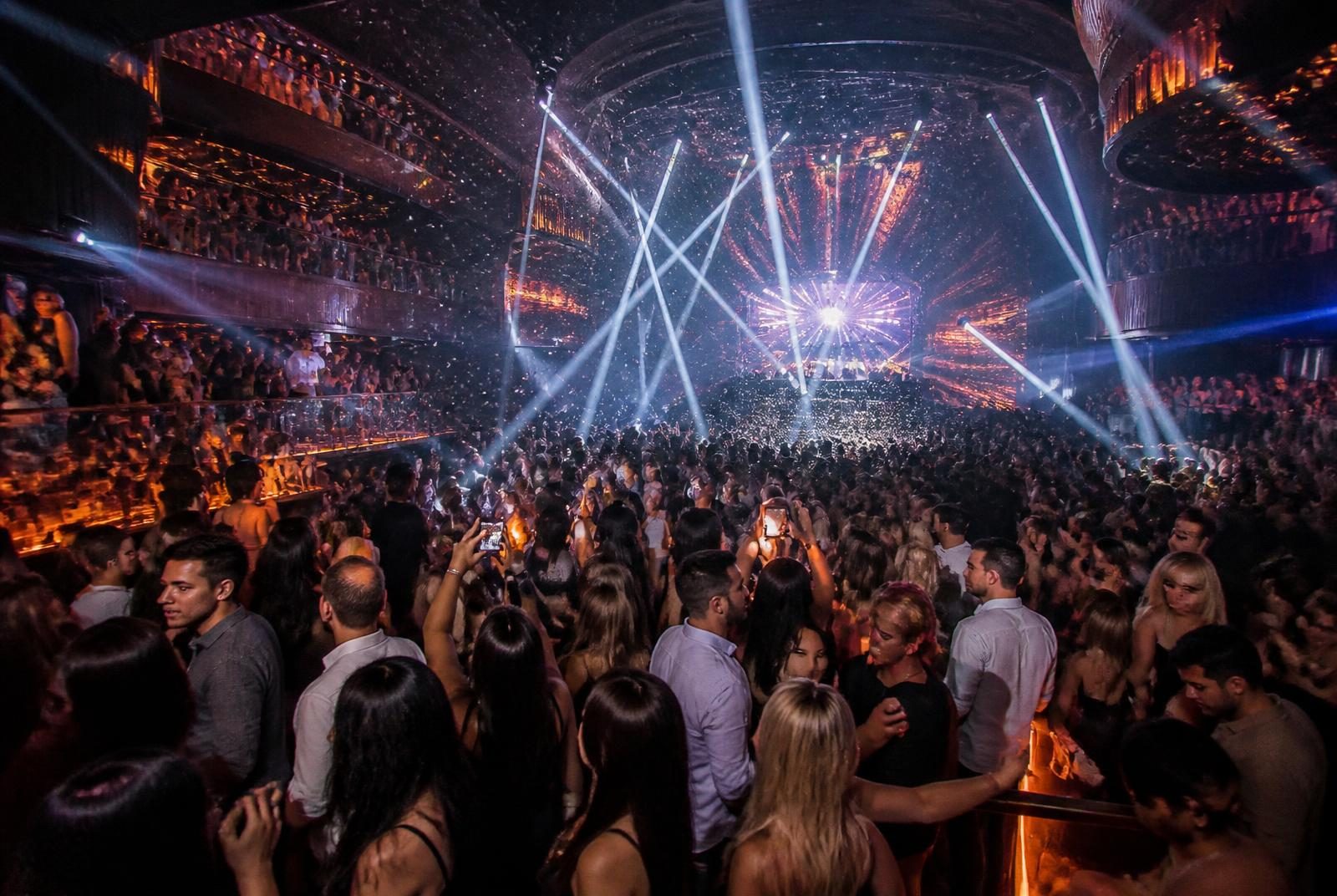 Cancun nightlife experience inside a multi-level Hotel Zone superclub packed with adult partygoers under laser lights
