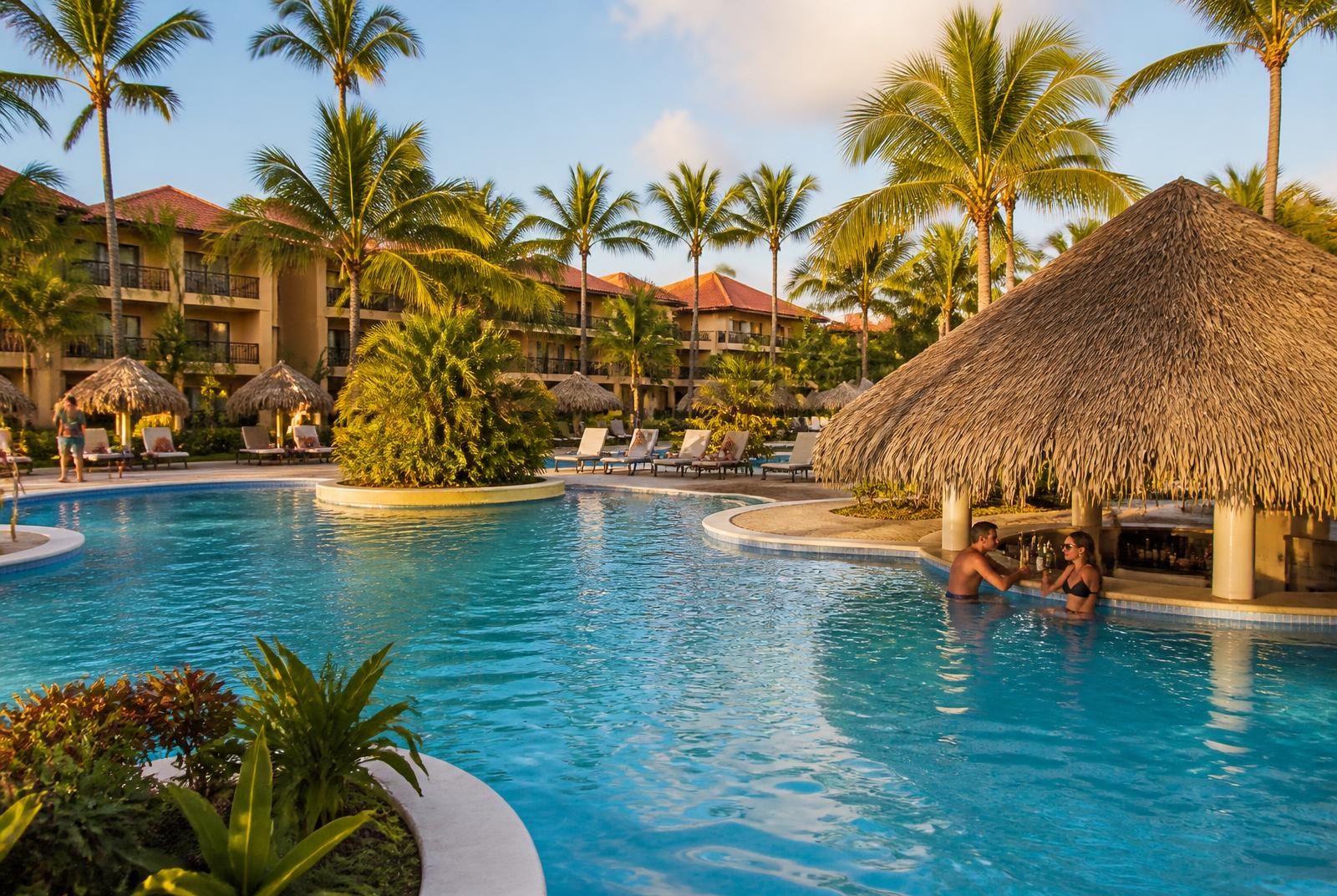 Punta Cana resort vacation: a spread-out low-rise all-inclusive resort in the Dominican Republic with palm gardens, pool and swim-up palapa bar