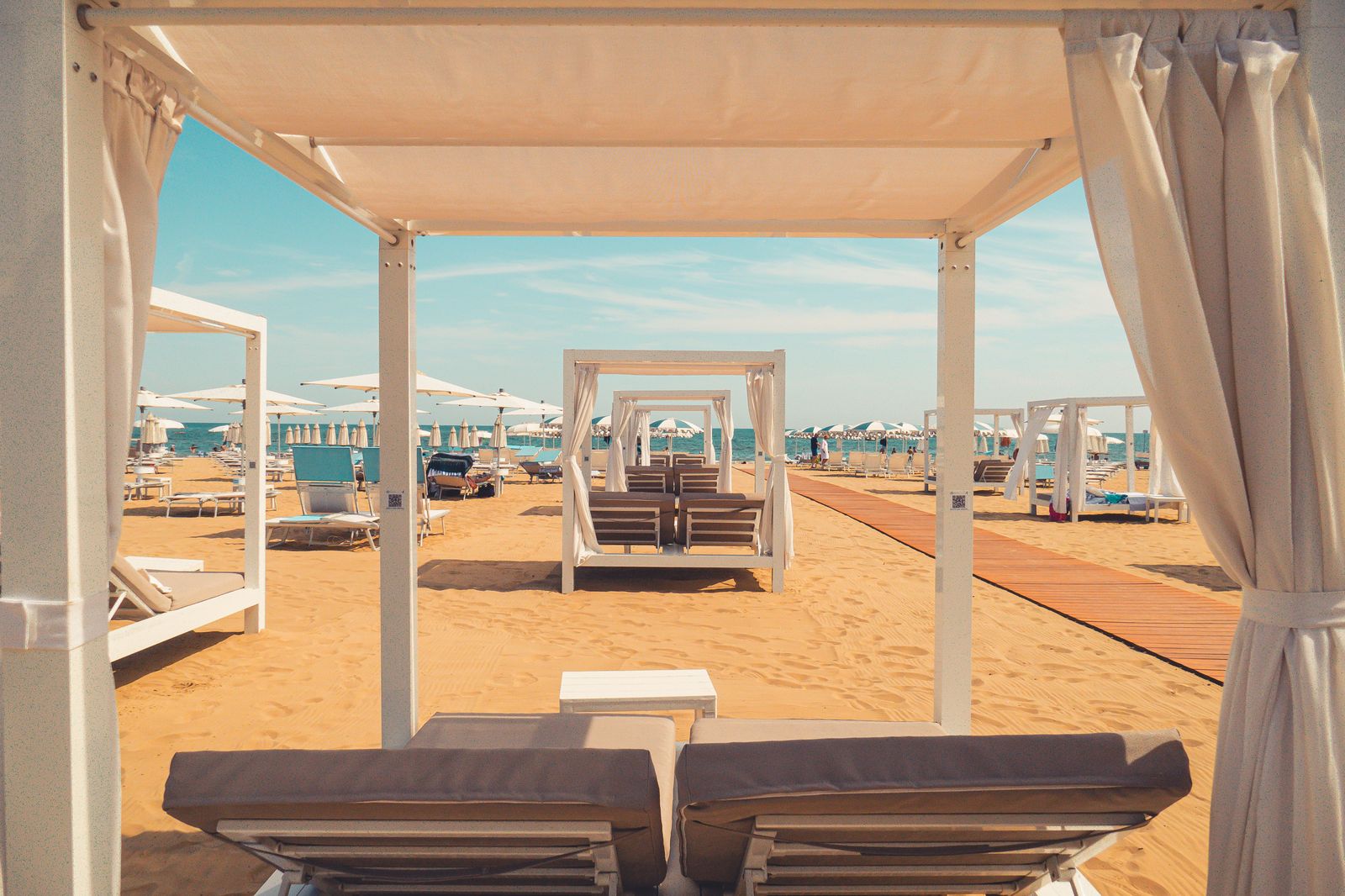 Beach cabanas set up along the sand