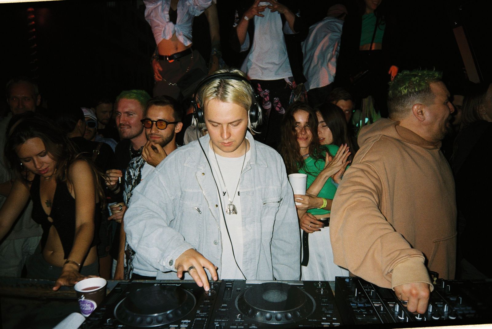 A DJ playing to a late-night crowd