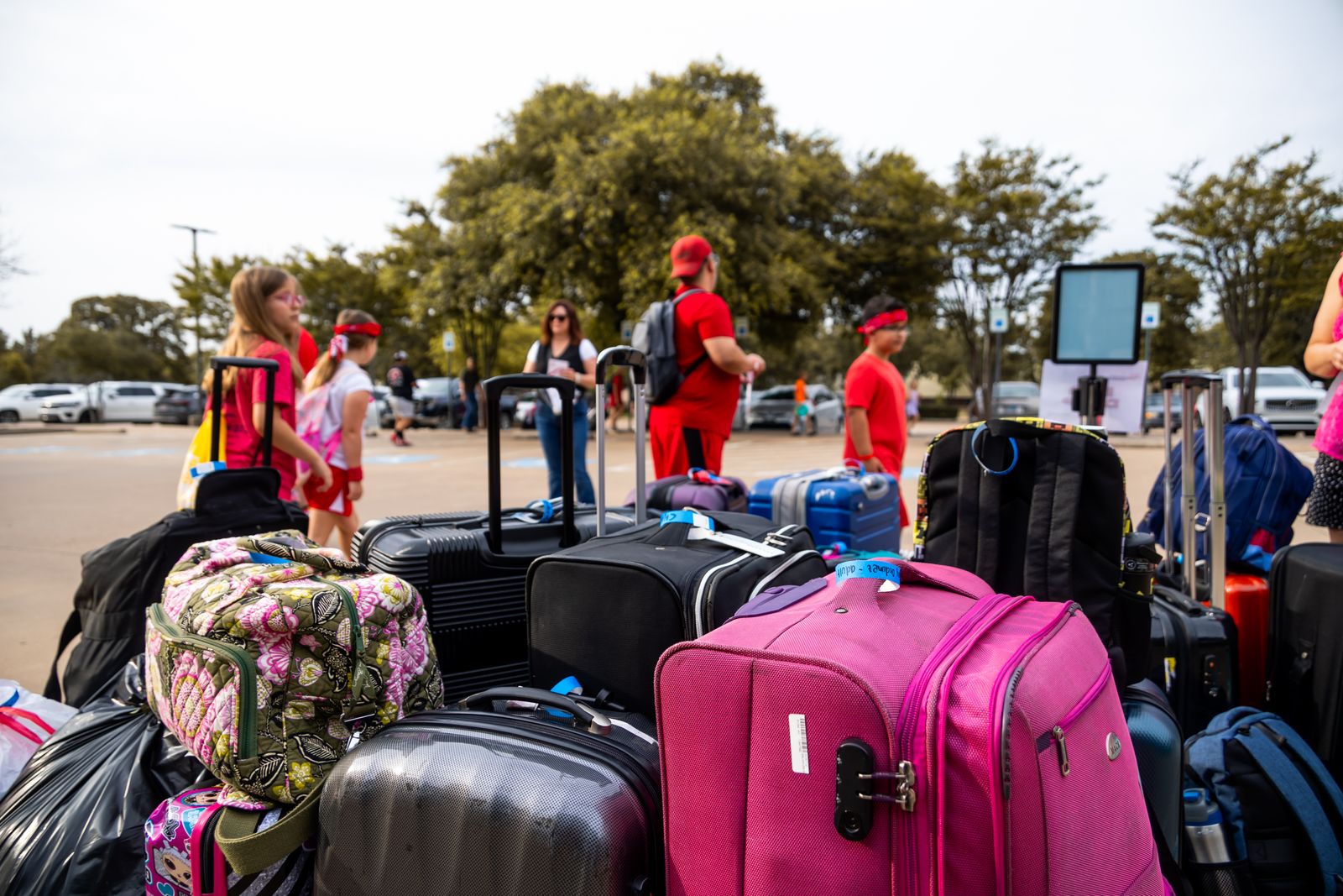 Travelers with luggage ready for pickup